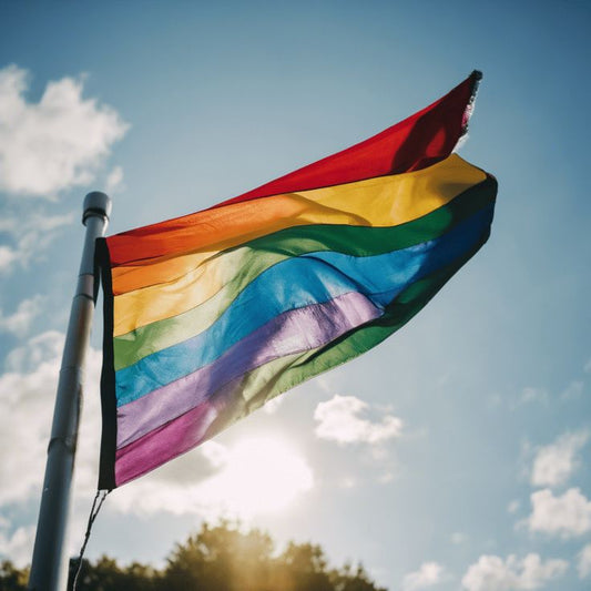 A close-up of a vibrant rainbow flag, symbolizing LGBTQ+ pride and inclusivity. The flag’s bold colors represent diversity, equality, and the celebration of individuality in beauty and wellness.